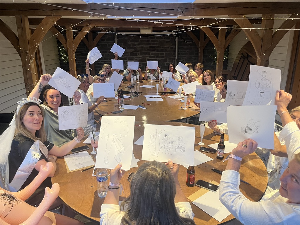 Birthday party guests at a life drawing class with a Hunky Butler