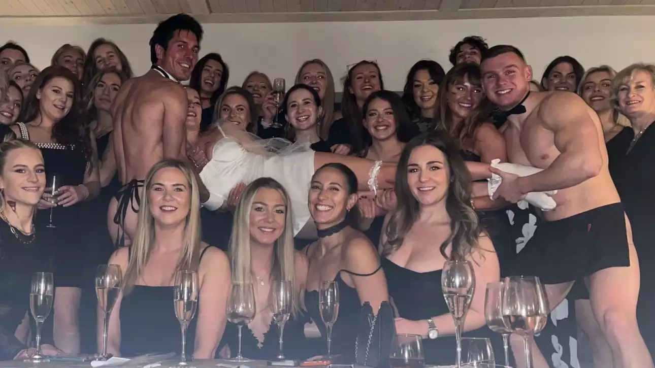 Topless butler serving cocktails at a UK party